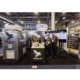 Flying Lion team at their ISC West trade show booth showcasing the DroneBooth™ rapid-deploy drone dock enclosure alongside pilot staffing services signage.