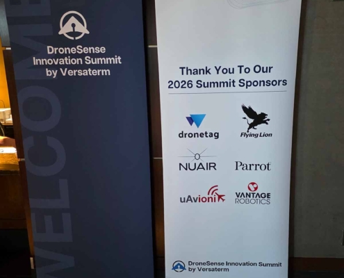 Sponsor display at the DroneSense Innovation Summit featuring Flying Lion and other UAS industry partners.